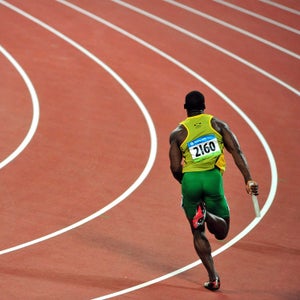 Jamaica’s Nesta Carter running the 4X100-meter relay in Beijing. He later cost his teammates their gold medals after being sanctioned for doping.