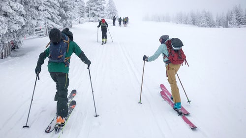 ԹϺ staffers skinning up the local ski hill in Santa Fe before work on a powder day.