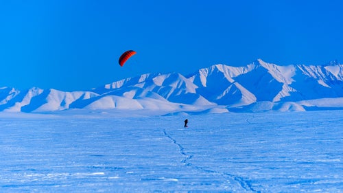 Traveling across the Arctic isn鈥檛 easy no matter how you do it, but Palmer, Alaska-based photographer Fredrik Norrsell and his wife, Nancy Pfeiffer, thought the winter landscape of the Arctic National Wildlife Refuge, north of the Brooks Range, would make for a nice ride. In April 2014, the couple covered about 75 miles using the wind and skis starting from the village of Kaktovik on the northern coast of Alaska. While most of the expedition was slow-going, with the right wind Norrsell and Pfeiffer could average near 10 miles per hour, with loaded sleds, just using the power of the wind. Here, Norrsell shares a few memories of the cold, breezy adventure.
Norrsell: Finally, after days of waiting, the wind began to blow and we were able to put our kites to the test.
