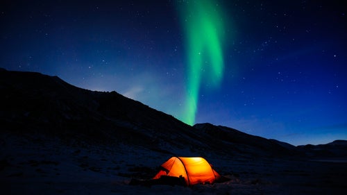 On this night, we set up our tent in this U-shaped valley illuminated by the northern lights just as the sun set behind the peaks of the Brooks Range.