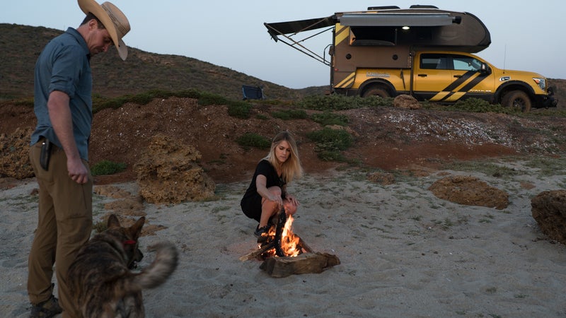 We were just fooling around in that top photo; this one's much more accurate. Virginia builds a fire while I tell a random story and Wiley eagerly awaits scraps.