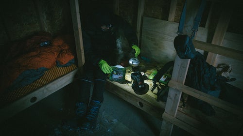 When the temperature dropped to minus 40, we took refuge inside a small wooden shelter in Ophir—385 miles into the race—to cook a hot, dehydrated meal and get some sleep. By morning, the shack was like an icebox. We struggled to repack our bikes and hit the trail.