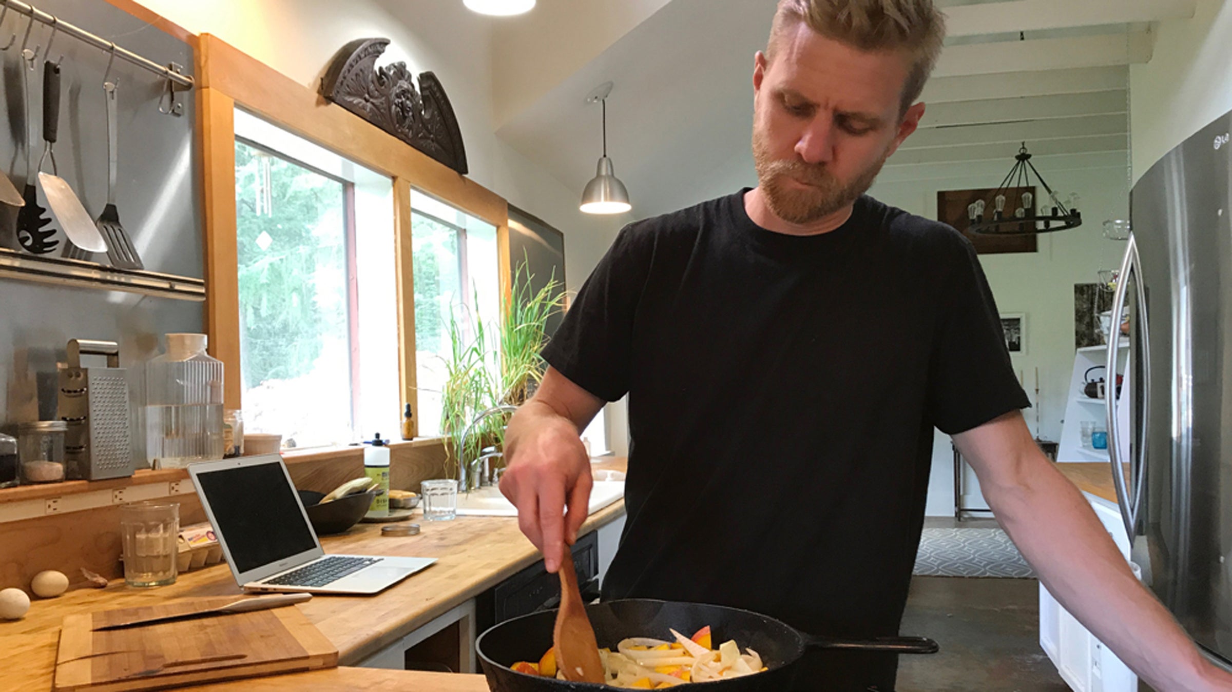 man cooking a meal on a stove