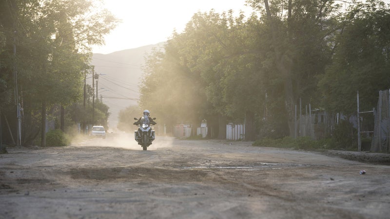 Just an average neighborhood street in Baja. Would you really want to ride a Harley down this?