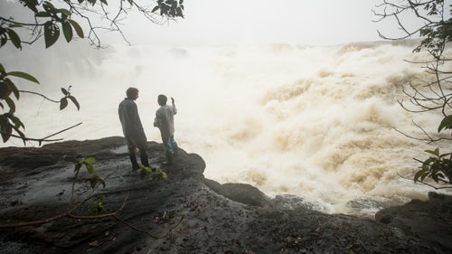 Jules Domine (left) chats with a local fisherman on April 20, minutes before a FARC guard arrived to detain the kayakers. The guard told them to gather all of their stuff and come to a FARC camp a few miles away. “We didn’t really have a choice in the matter,” Stookesberry says. “We told them we didn’t want to come with them, but if it was necessary and it was something that would end quickly, then we would happily do it.”
The guard brought the kayakers to the camp on the banks of the river and told them not to use any electronics.

However, Stookesberry discretely used his Garmin InReach satellite communicator to text his friend, Taylor Robertson, as well as a local Colombian contact, who had contact with a private security company as well as government officials in Colombia and the U.S. Stookesberry told Robertson to wait at least 24 hours before contacting any government agencies, hoping that the situation would resolve itself.
