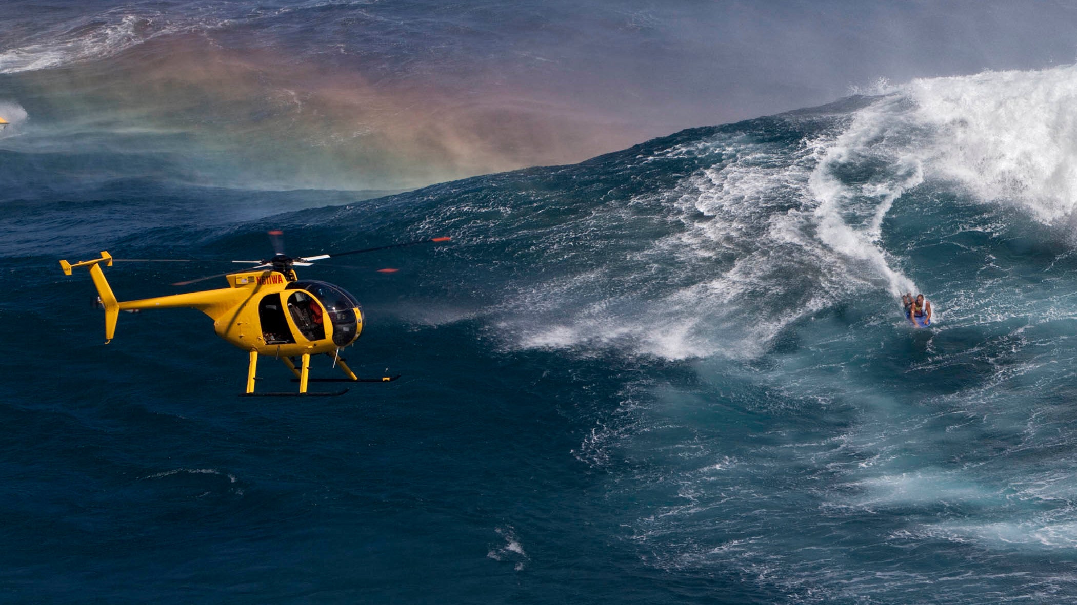Don Shearer flies one of his helicopters above a swell. 