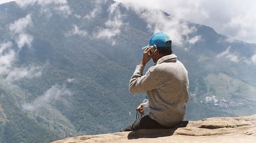 A man talks on his phone at Horton Plains National Park in Sri Lanka.