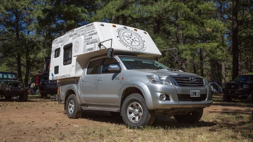 2012 Toyota Hilux with MotorHome Time Slide-In Camper
At first glance, it looks like a standard Tacoma with a camper. We chose it, however, because it’s actually a Toyota Hilux, the tougher, diesel cousin of the Tacoma. You can’t buy the Hilux in the States, but the truck is legendary among overlanders (thanks in part to the guys from Top Gear). This one is owned by Monica Amato and Mariano Barros, who drove it north from Argentina through 13 countries, logging almost 19,000 miles. They’re now headed to Vancouver, then Chicago, New York City, and Miami. From Miami, they’ll ship the truck to Uruguay, then drive it back home.