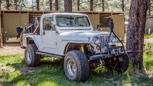 1993 Jeep CJ-8
Toyotas get a lot of love in the overlanding community, but the venerable Jeep Wrangler (in all it’s many forms) is a classic American 4x4 that we’d be remiss to leave out. We chose this heavily modified Jeep CJ-8 Scrambler because it’s both rare and awesome. Produced between 1981 and 1986, it has a longer wheelbase than the CJ-7 and a truck-bed-like rear, meaning you got more storage space and the same trail worthiness. Owner Ken Josten swapped in heavy-duty axles and is running 35-inch tires.
