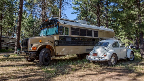 1995 Bluebird School Bus and 1967 Volkswagen Beetle
Larry Stuber calls his bus the Ark, and he specifically chose a Bluebird model because repair parts are available in various countries around the world. (He plans to take it to South America eventually.) Inside, there’s enough room to sleep four, plus a toilet, shower, kitchen, and solar electricity. Stuber tows his 1967 Beetle with all-terrain tires and uses the car to explore once he and his family have picked a camp spot.