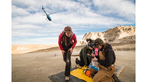 The capture crew heads off to net more deer as biologists Anna Ortega (left) and Katey Huggler (right) begin collecting data. It鈥檚 essential that the biologists work as quickly as possible to minimize stress on the animal.