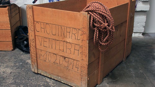 Kernmantle Rope Spool Crates
These crates date back to the early 1970s. They came from Switzerland packed with spools of kernmantle rope, which Chouinard Equipment employees would measure into lengths of 150 and 165 meters and sell as individual climbing ropes. The empty crates were apparently scattered about the growing headquarters and, as a free source of wood, repurposed into tables, benches, or office shelving. Julio Varela remembers assembling the crates into a kind of outdoor kitchen for the pig roasts he would host behind the Tin Shed.
To former Patagonia sales director Ric Hatch, the crate became a gift box of sorts. He had saved all of his samples from his years with the company (1979 to 2004) but couldn’t bring himself to toss or sell them. “I don’t know,” says Hatch, “I had an intuition that old clothing might have historical value. I just kind of kept all this stuff. I had an old Chouinard wooden crate that ropes came over from Europe in, and I just piled it all in there and brought it over to Val and Terri at the archives. Now they have it, and I have nothing except the greatest appreciation from Val.”