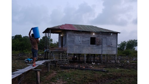 We quickly learned that living in the backwaters requires extensive effort to obtain fresh drinking water. This particular man paddled his dugout canoe across a lagoon each morning before sunrise, to access a spring for his daily supply.