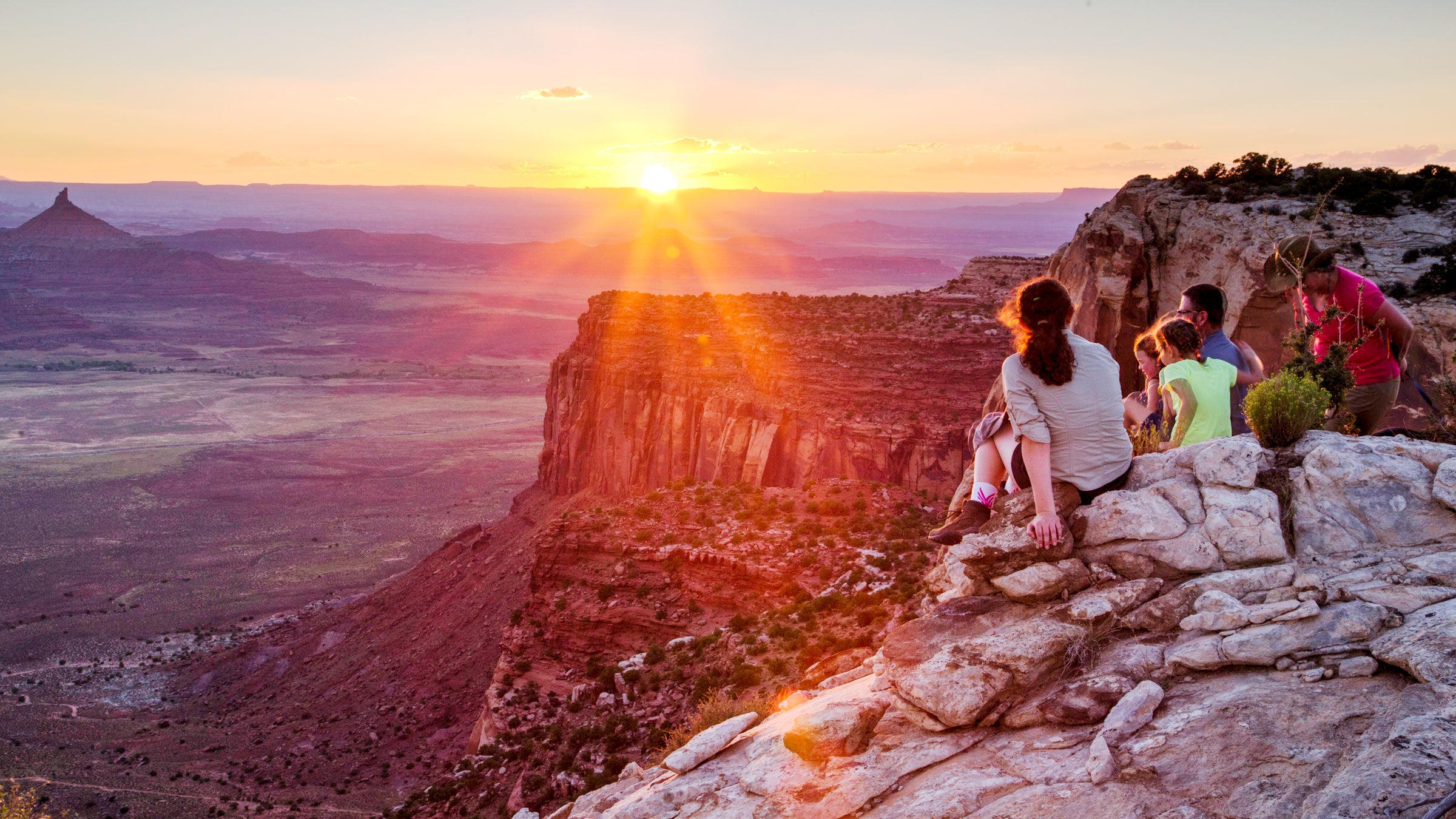 A family watches the sun set on Bears Ears National Monument. 