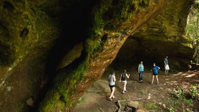The Breathitt County Hiking Club reaches one of the many amphitheaters and geological formations scattered along the trail.