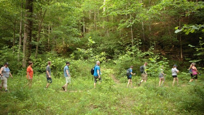 Members of the Breathitt County Hiking Club head back to their cars after ending the hike.