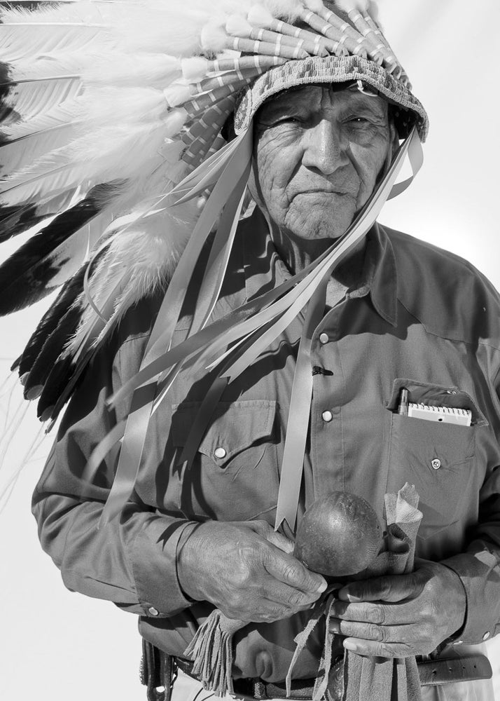Grant wearing the headdress of the Crow Nation.