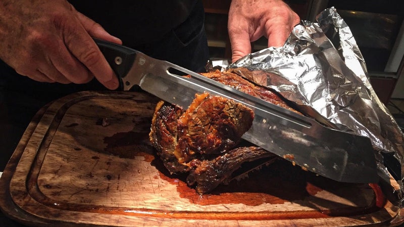 Pelton uses DPx Gear's largest knife, the CHOP, to slice up some roast beef. He insists this is practical, but we all know he's just showing off.