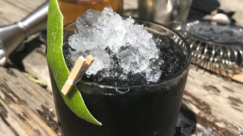 Alpine Distilling created the Cinquante Noir with activated charcoal, whiskey, and bourbon.