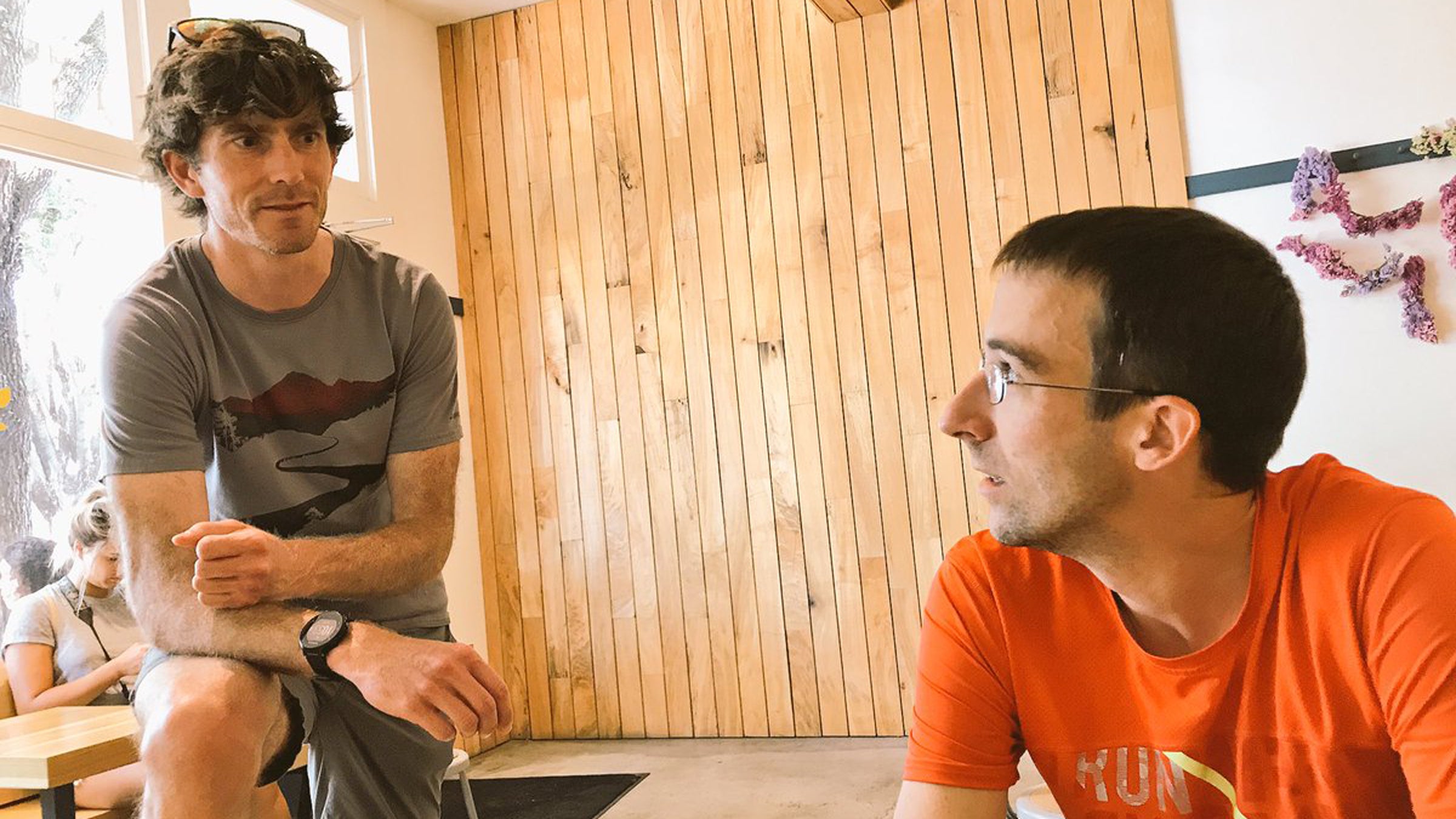 Magness and Garrett Heath consult each other about running nerdery.