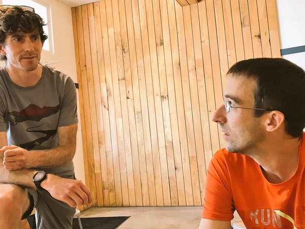 Magness and Garrett Heath consult each other about running nerdery.