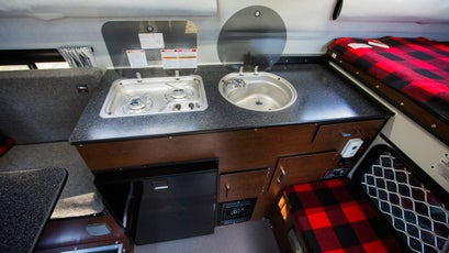 A full sink and stove, paired with an ice-cold refigerator pushes the camper into RV territory.