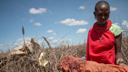 Lenjodor Cecilia holds rags used to stop bleeding after KDF soliders terrorized a small collection of Samaburu huts.