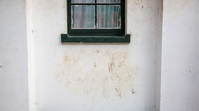 Markings left under a window where baboons have climbed to the roof.