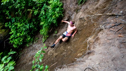Trey Ingalls of Seward, AK, makes a controlled slide down an embankment in the junior's race.