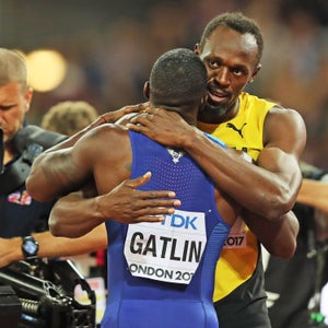 Usain Bolt embraces Justin Gatlin after losing to him in his final professional race at the IAAF World Championships, London.