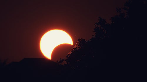 During a solar eclipse, the moon moves between the earth and the sun.