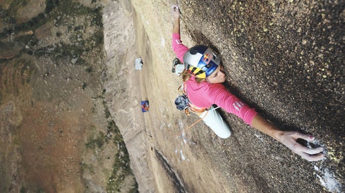 Sasha DiGiulian climbs Mora Mora (5.14b, 8c) on the remote massif domes of Tsaranoro in Madagascar.