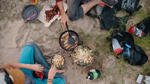 The JetBoil Genesis system uses one propane bottle for multiple burners.