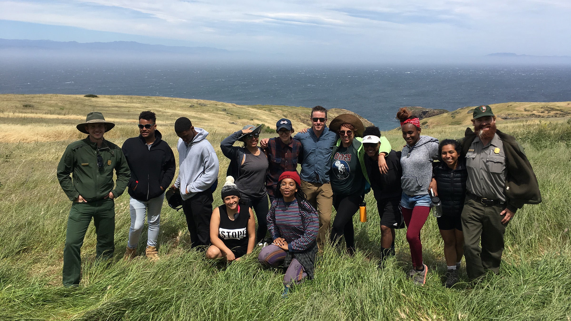 The group, atop cliffs above the Pacific ocean.