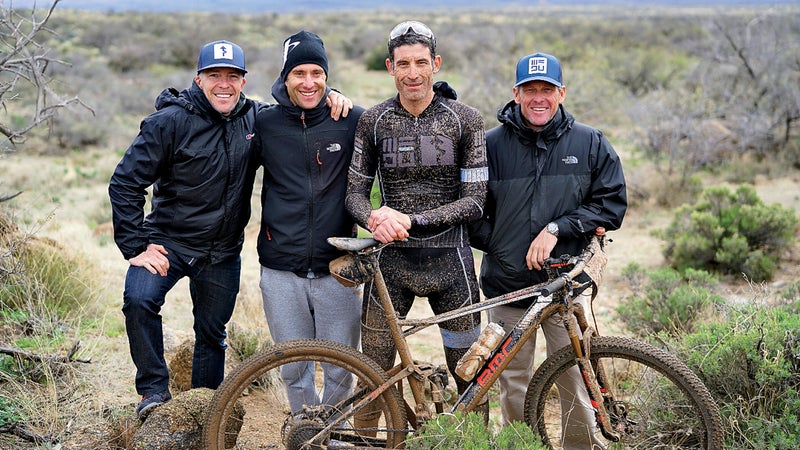 (L to R) Dylan Casey, Christian Vandevelde, George Hincapie and Armstrong pose for a WEDU team photo after finishing 3rd in the 24 Hours in the Old Pueblo 24 hour mountain bike race in Tucson, Arizona February 19, 2017. Casey, Vandevelde, Hincapie and Armstrong have been friends since they were teammates on US Postal cycling team.