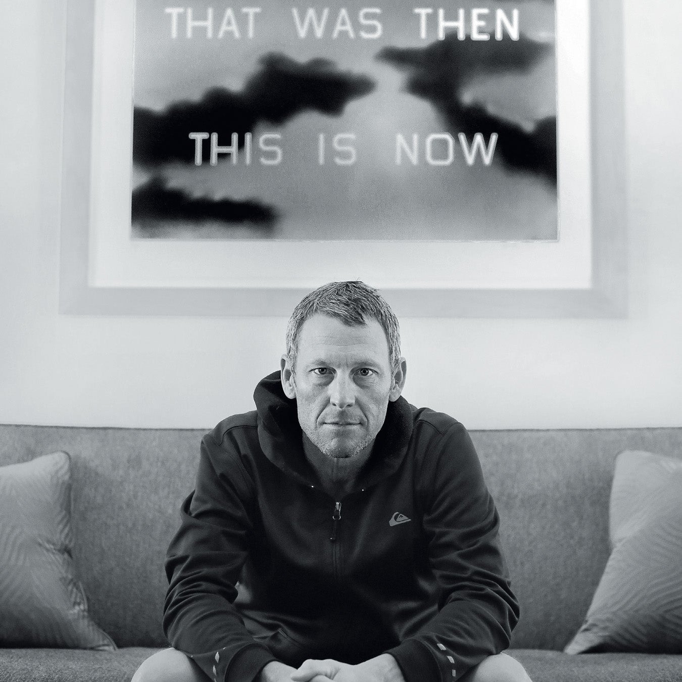 Armstrong relaxes at his home in Austin, Texas February 5, 2016 under an art piece by friend and famous American artist Ed Ruscha.