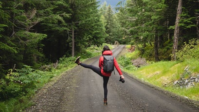 Peak Design employee Annie Nyborg takes a break to stretch amidst the four-mile hike down from the site of the proposed Constantine mine staging area.