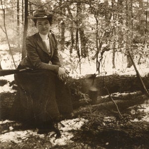 Hubbard poses on a log during an expedition.