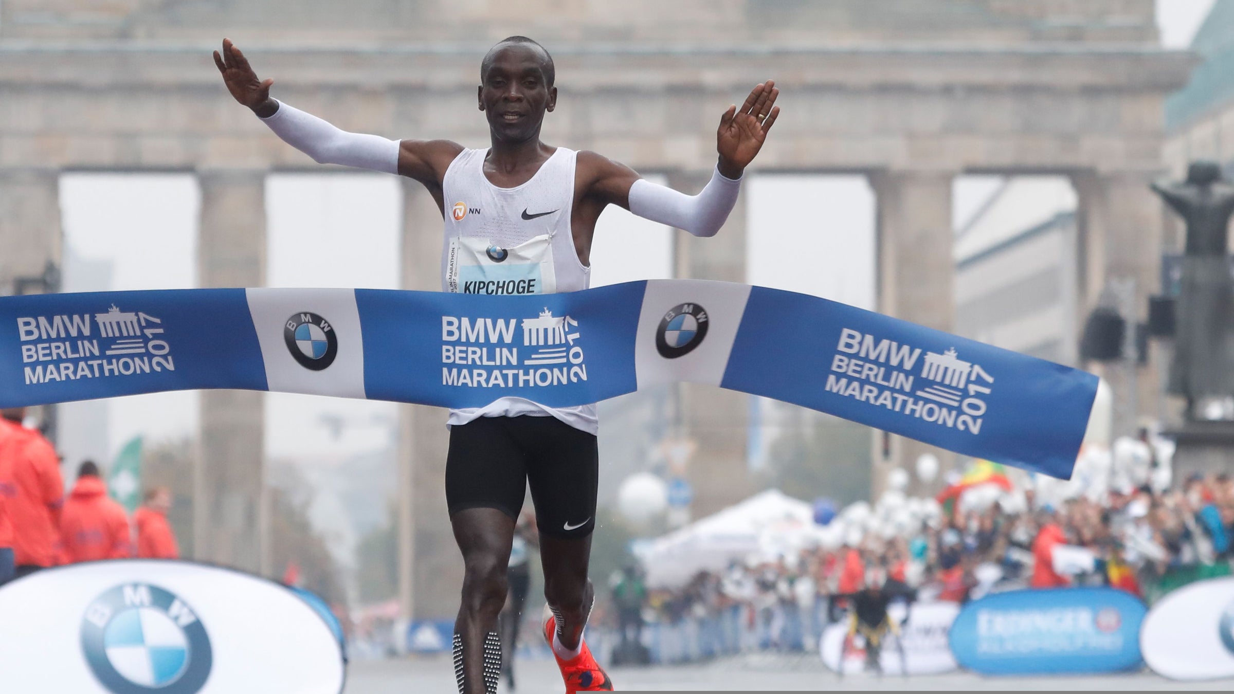 Eliud Kipchoge of Kenya crosses the finish line to win the Berlin Marathon on September 24, 2017 in Berlin