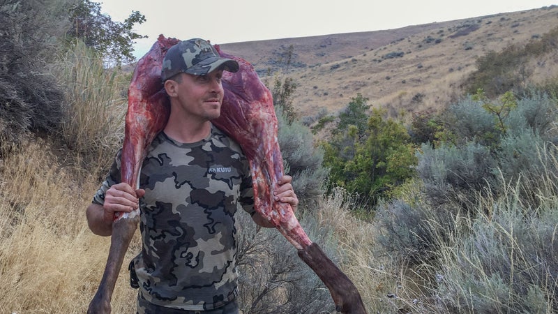 We eventually tailed the elk into their bedding ground and stalked in on them. Three sure shots equaled three downed elk. But we were an entire mountain away from the truck. Using as much of the animal as possible while still being able to pack them out using manpower—and doing so in a timely manner to keep the meat fresh—created a real challenge. The heads and skins, the quarters (pictured here), the torso, and the organs were separated and packed out individually. When we got home, we had to buy an additional chest freezer to house all the meat. I reckon we brought out 1,200 pounds.
