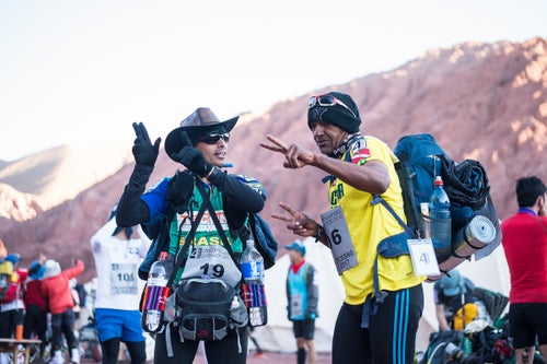 Day 1 starting line.: Vlad and Iniceto dance to keep warm. Excitement for the adventure ahead iis noticed all around camp.