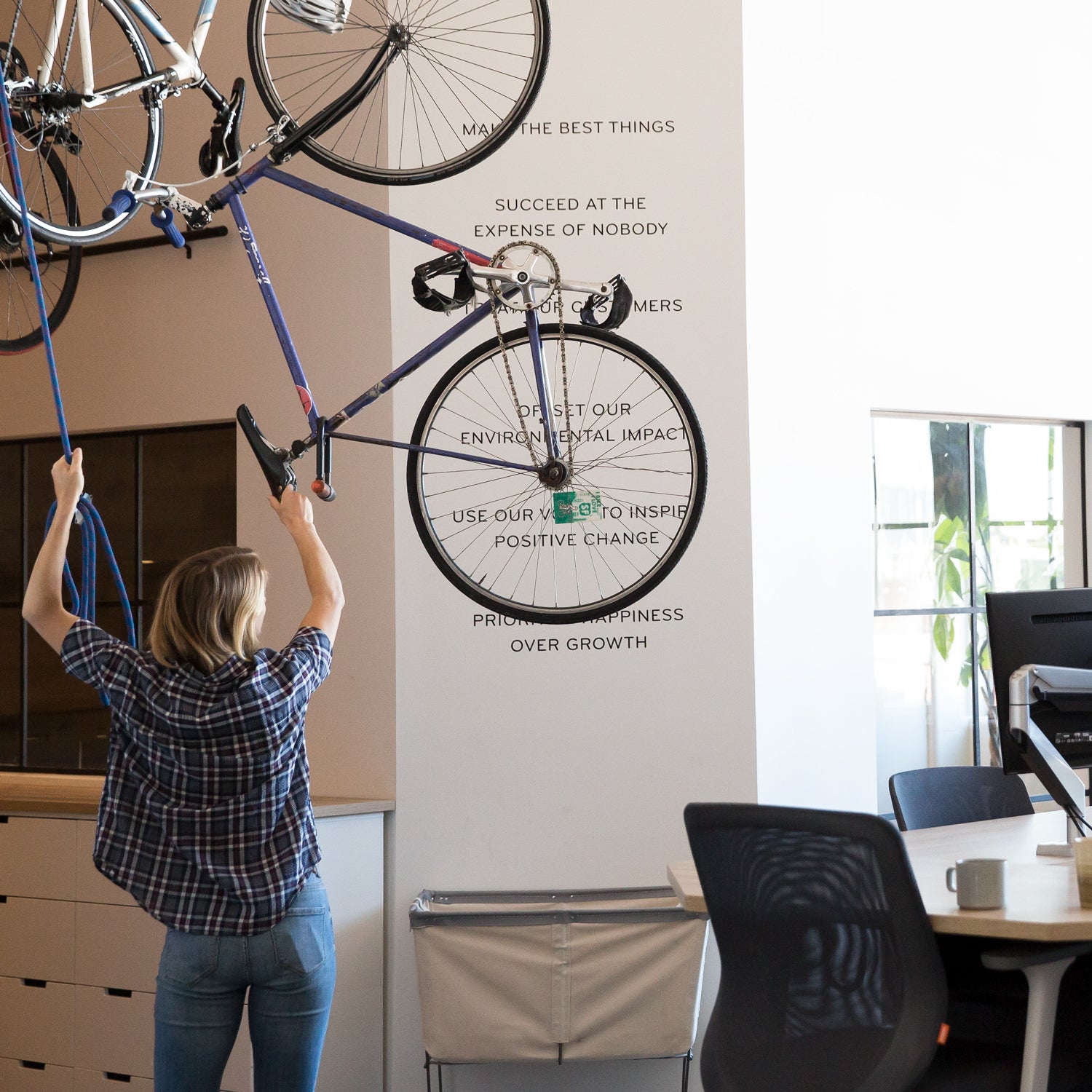 Of course a design company has a hoist system for bikes. The backbone of the company though, is the six point mission statement behind the bike.