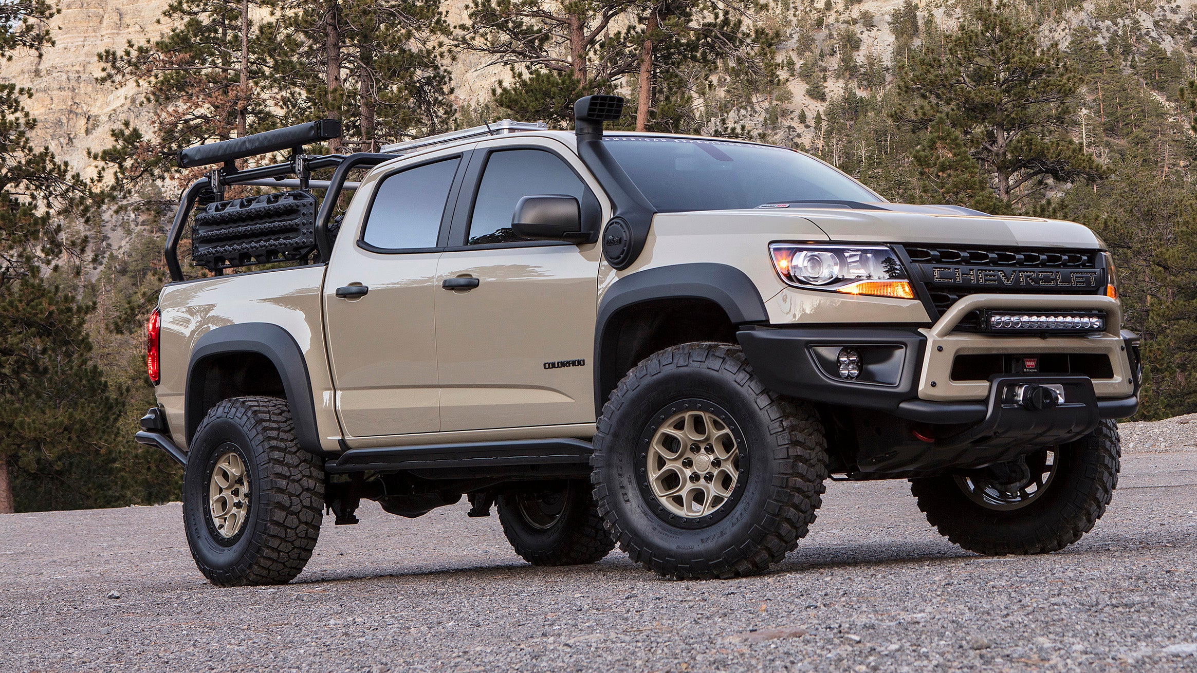 Let's see, Toyota paint code 4Q2, biggest snorkel ever, fake beadlocks, plastic bumpers, and a cheap LED light bar from Pep Boys? Yep, what've we've got here is a fauxverlander. Chevy brought this heap to the show for its stand. 