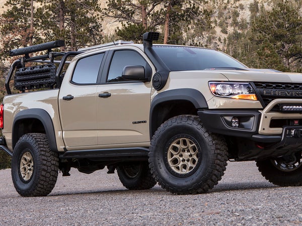 Let's see, Toyota paint code 4Q2, biggest snorkel ever, fake beadlocks, plastic bumpers, and a cheap LED light bar from Pep Boys? Yep, what've we've got here is a fauxverlander. Chevy brought this heap to the show for its stand.