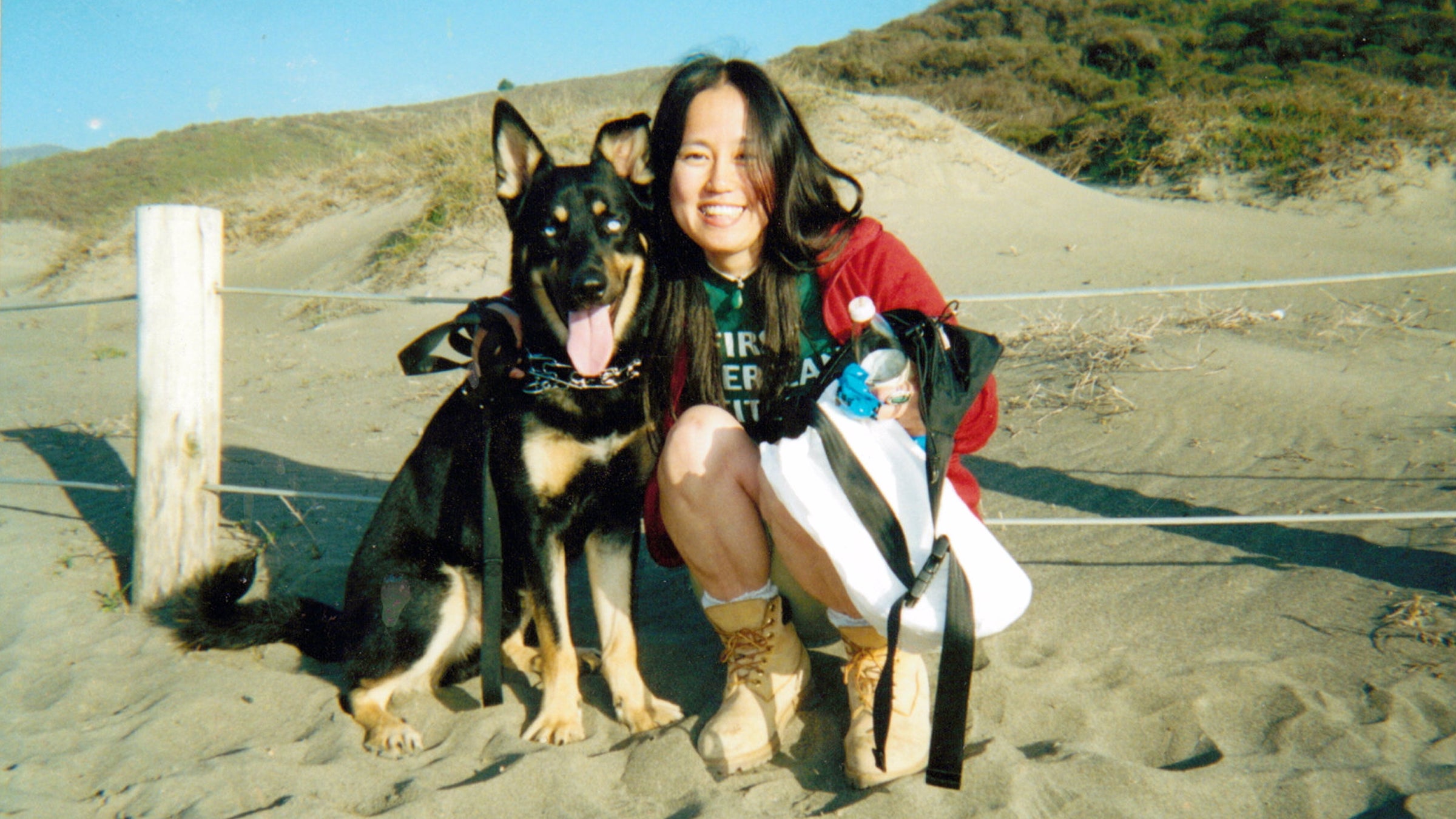 Tomomi Hanamure and her dog, Blues, at Muir Beach, California, January 2002.