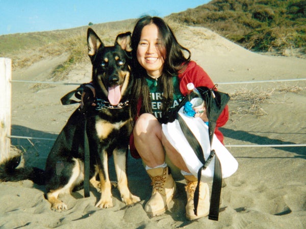 Tomomi Hanamure and her dog, Blues, at Muir Beach, California, January 2002.