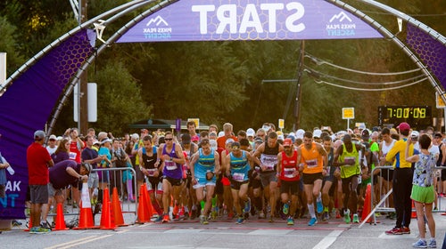 Runners at the starting line in a rugged race up 14,115 foot Pikes Peak in Manitou Springs, Colorado.
