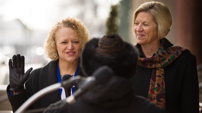 Jackie Biskupski, left, is sworn in as Salt Lake City's first openly gay mayor next to her fiancée, Betty Iverson, during a ceremony on Jan. 4, 2016, in Salt Lake City.