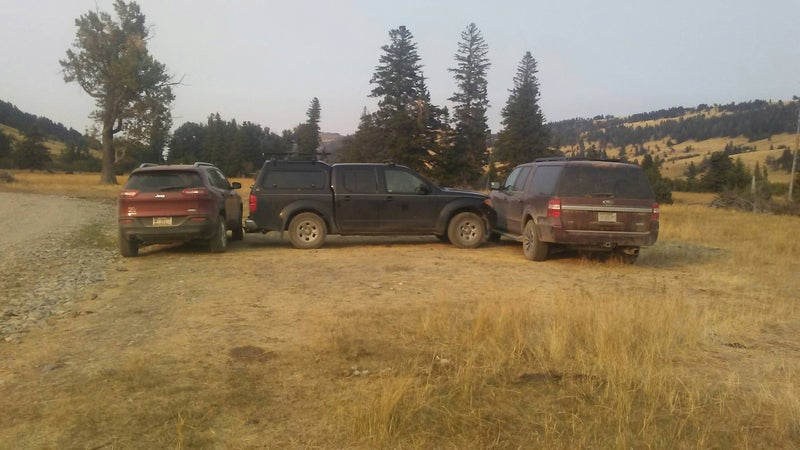 Ranch vehicles block a car parked by a family that went hiking at what is now a disputed access on the east side of Montana's Crazy Mountains earlier this year.