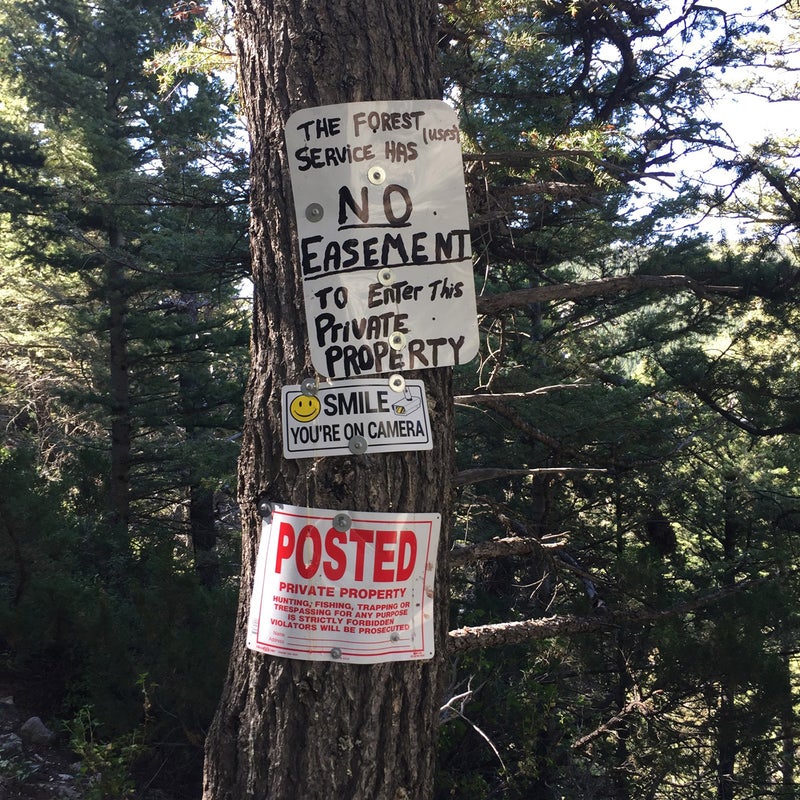 Signs posted by landowners where disputed Trail 136 crosses a private ranch in the east Crazies on its way to public lands. Advocates say the trail appears on forest maps at least as far back as the 1930s.